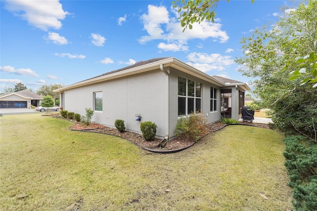 view of property exterior with a lawn