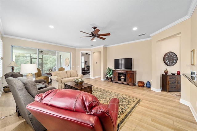 living room featuring crown molding, ceiling fan, and light hardwood / wood-style floors