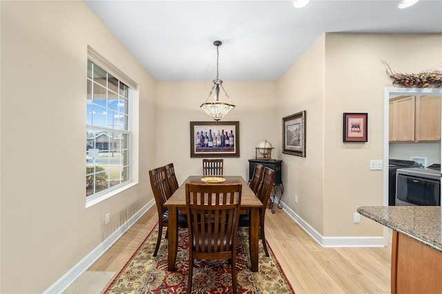 dining room with light hardwood / wood-style flooring