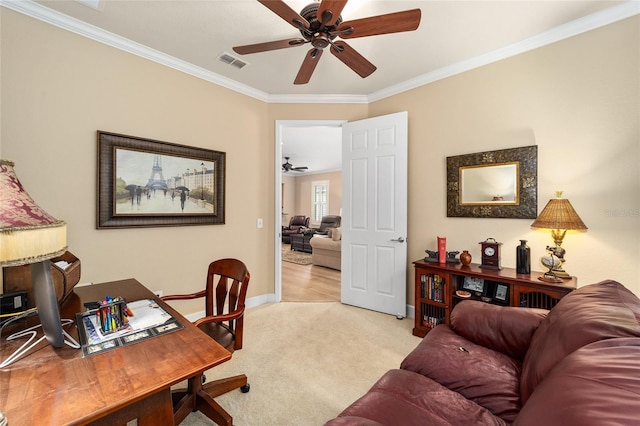 carpeted office with crown molding and ceiling fan