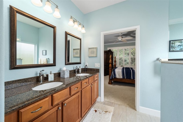 bathroom featuring ceiling fan and vanity