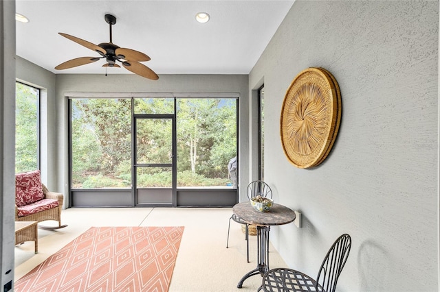 sunroom / solarium with ceiling fan