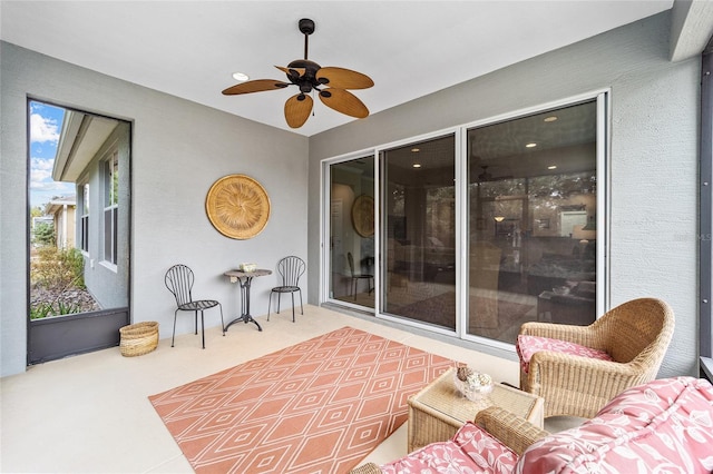 view of patio featuring ceiling fan