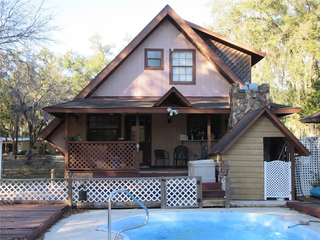 rear view of house with a porch