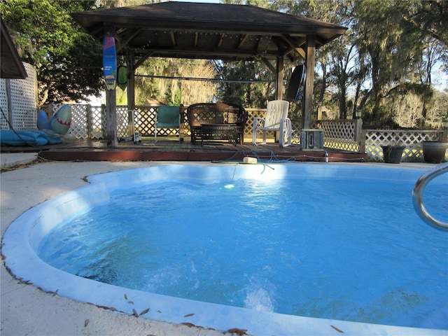 view of swimming pool featuring a gazebo