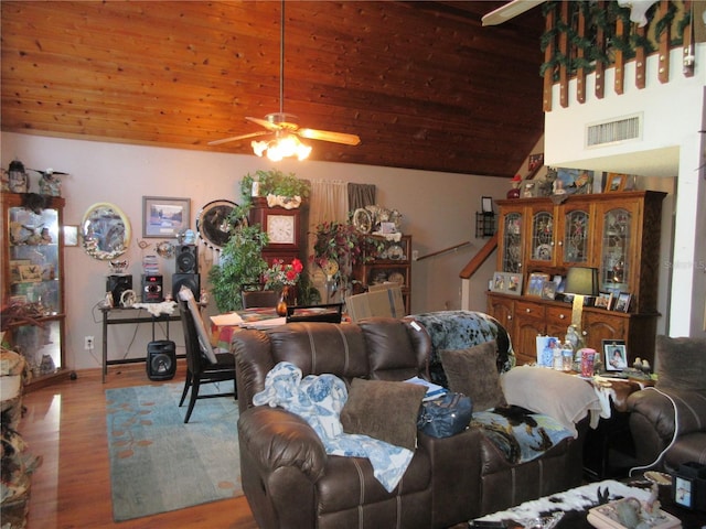 living room featuring vaulted ceiling, wooden ceiling, ceiling fan, and light wood-type flooring