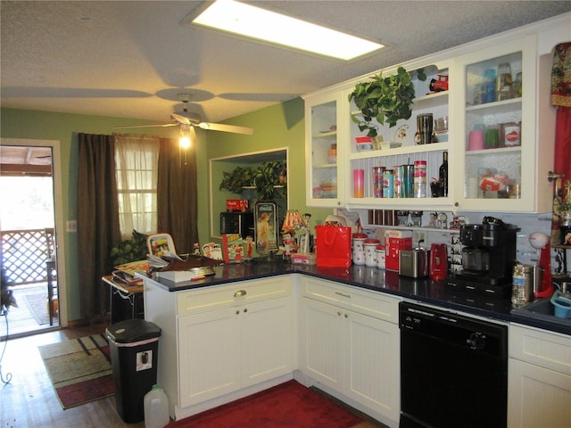 kitchen with white cabinetry, ceiling fan, dark wood-type flooring, and black dishwasher