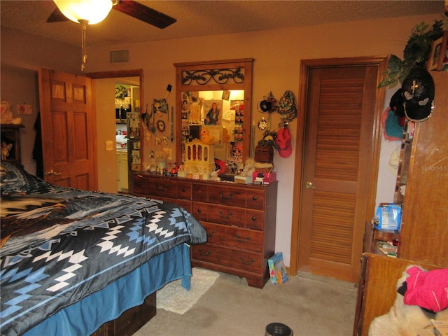 bedroom with light carpet and ceiling fan