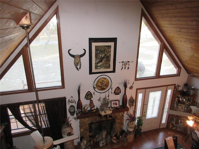 living room featuring hardwood / wood-style flooring and vaulted ceiling