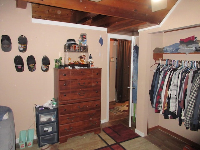 bedroom with dark hardwood / wood-style floors