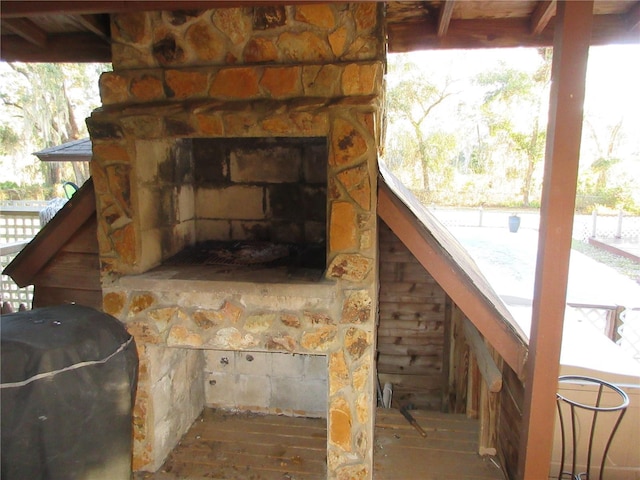 exterior details featuring a fireplace