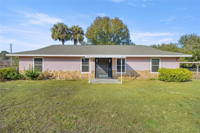 ranch-style house featuring a front lawn