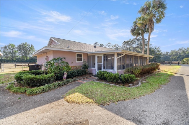 view of front of house featuring a sunroom