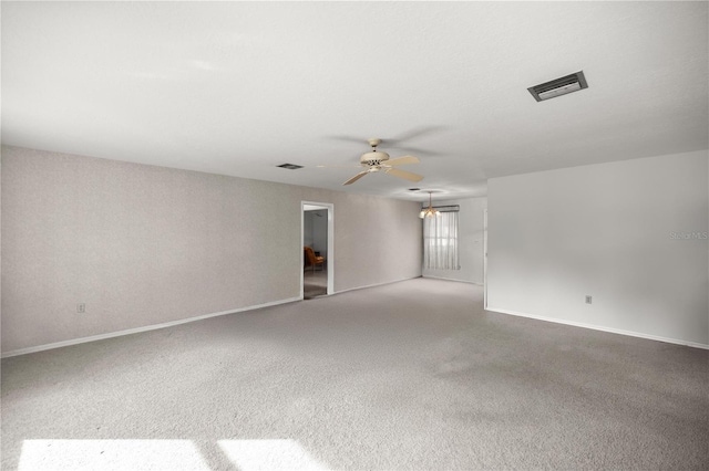 spare room with light carpet and ceiling fan