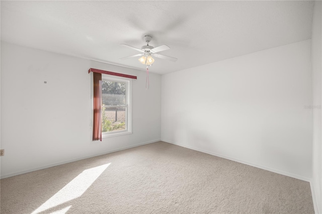 unfurnished room with carpet floors and ceiling fan