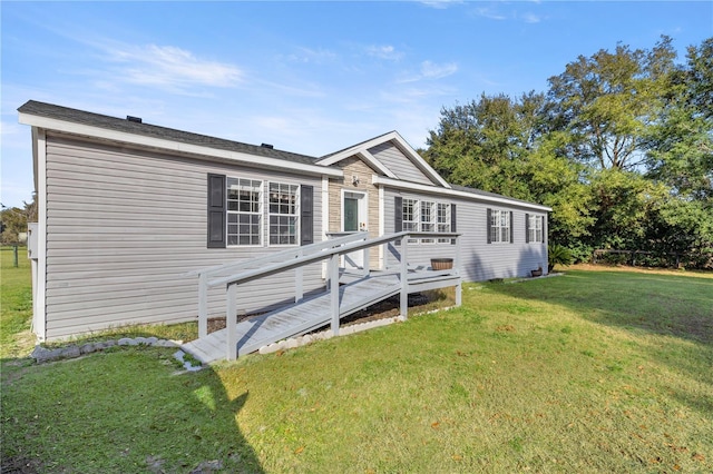 view of front of property featuring a wooden deck and a front yard