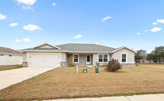 ranch-style home featuring stucco siding, driveway, a front lawn, stone siding, and an attached garage