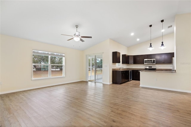 unfurnished living room featuring baseboards, a ceiling fan, and light wood-style floors