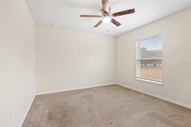 unfurnished room with baseboards, carpet, and ceiling fan