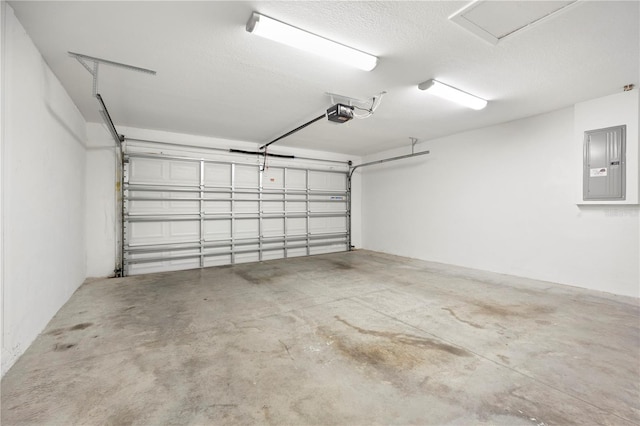 garage featuring electric panel and a garage door opener