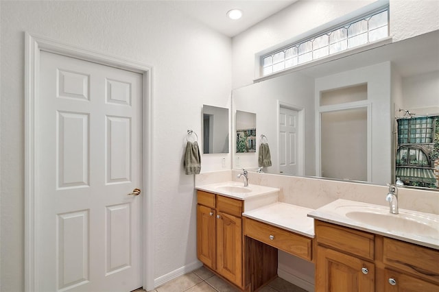 bathroom with tile patterned floors and vanity