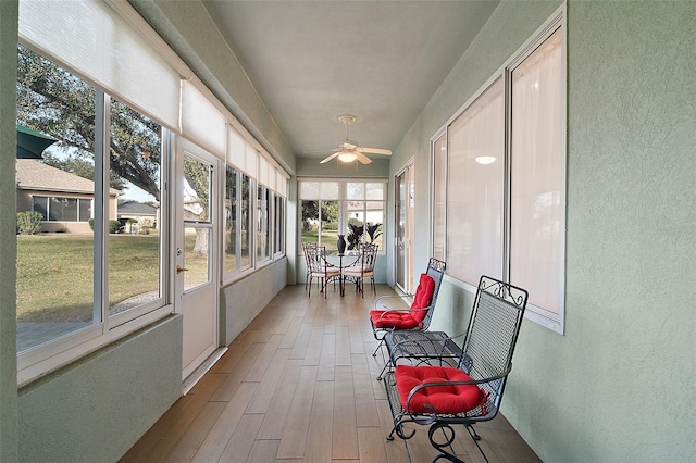 sunroom / solarium with ceiling fan