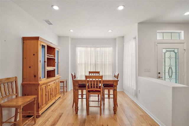 dining room with light hardwood / wood-style flooring