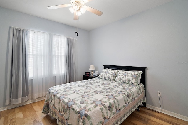 bedroom featuring ceiling fan and light hardwood / wood-style flooring