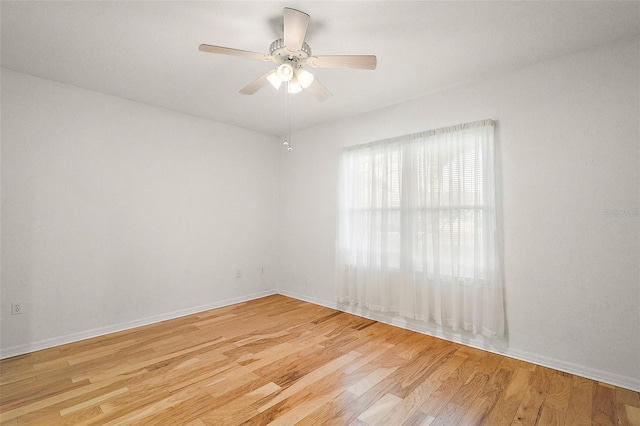 spare room with light hardwood / wood-style flooring and ceiling fan