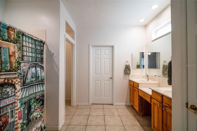 bathroom with tile patterned flooring and vanity