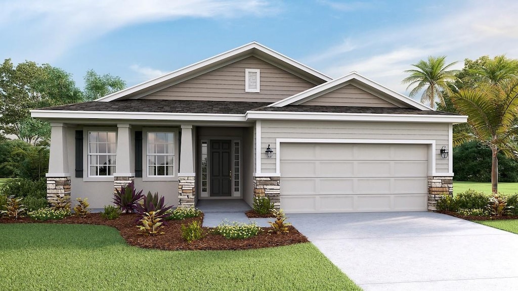 craftsman-style house featuring a garage and a front yard