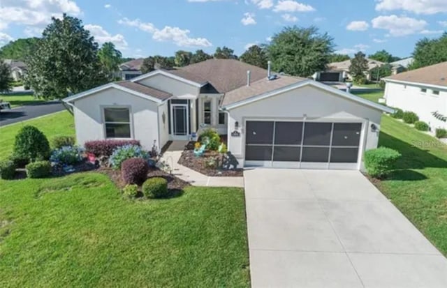 ranch-style house featuring concrete driveway, a front lawn, an attached garage, and stucco siding