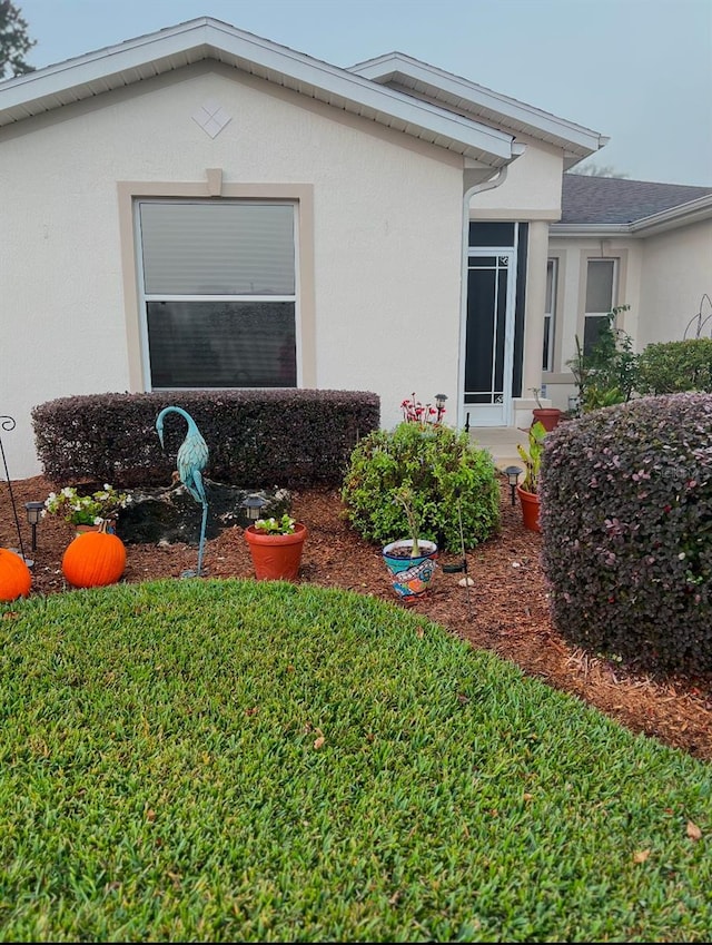 property entrance featuring stucco siding