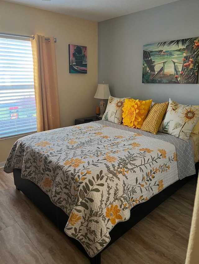 bedroom with wood finished floors