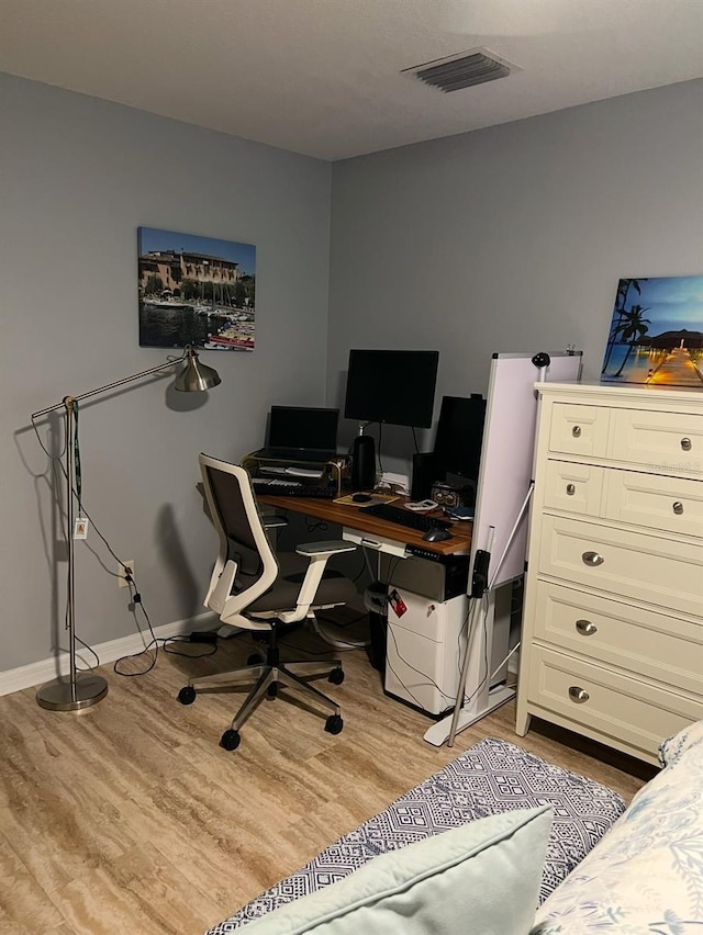 office space with light wood-type flooring