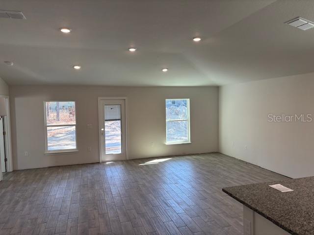 empty room featuring wood-type flooring