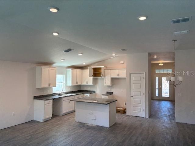 kitchen featuring white cabinetry, a healthy amount of sunlight, and a kitchen island