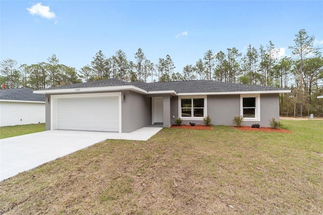 single story home with a garage, driveway, a front yard, and stucco siding