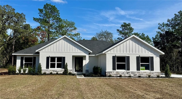 modern inspired farmhouse with a front yard