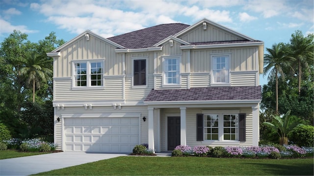 view of front facade with a garage and a front lawn