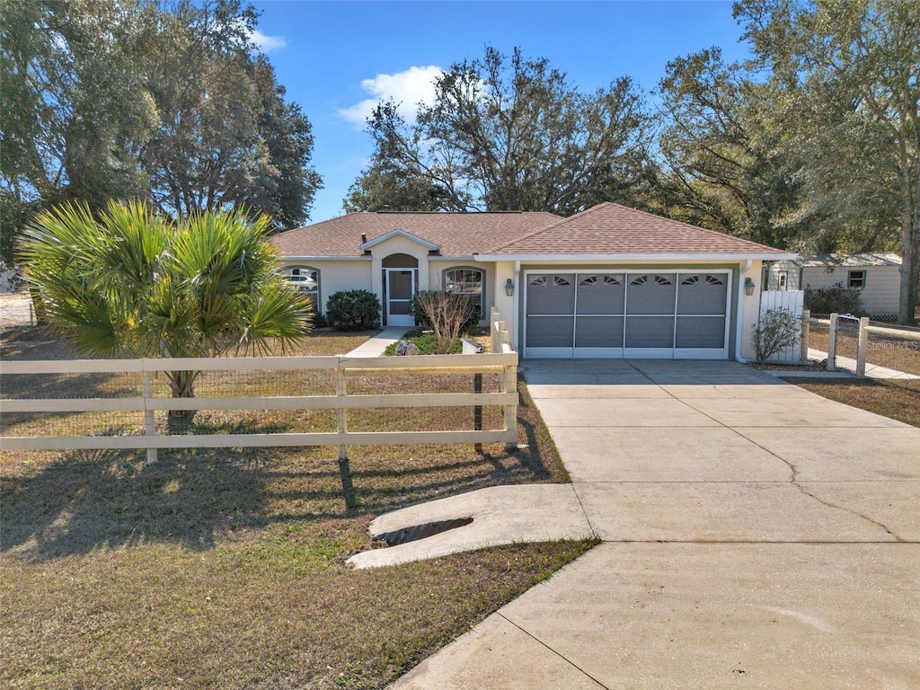 ranch-style house featuring a garage