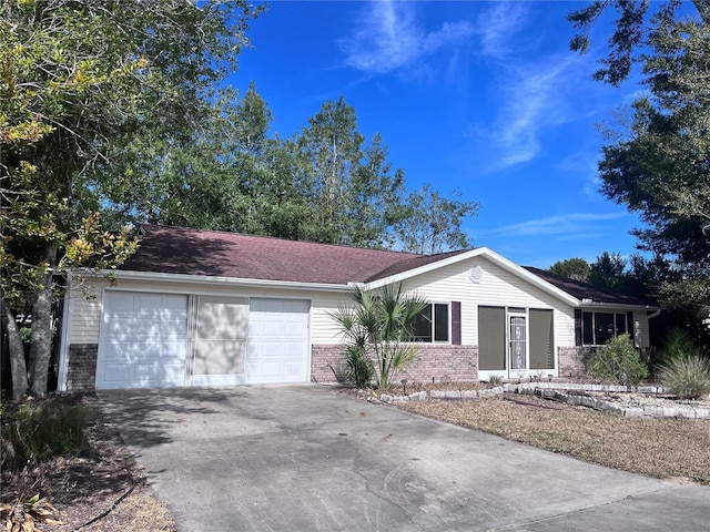 single story home featuring a garage