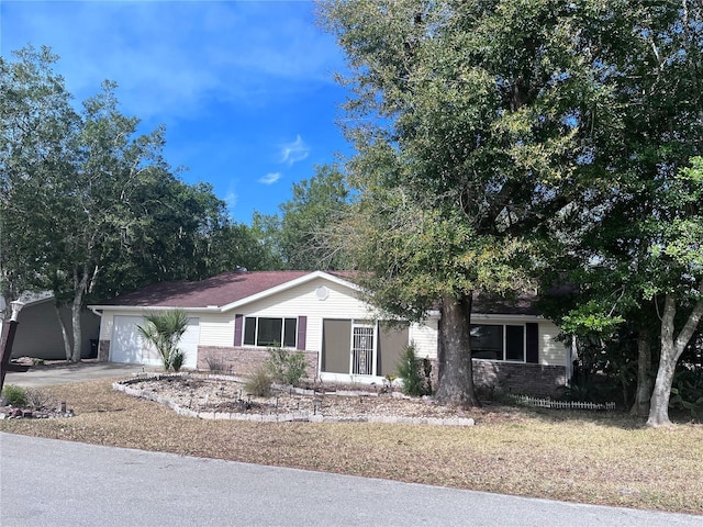 single story home with a garage