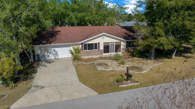 ranch-style home with concrete driveway, a garage, and brick siding