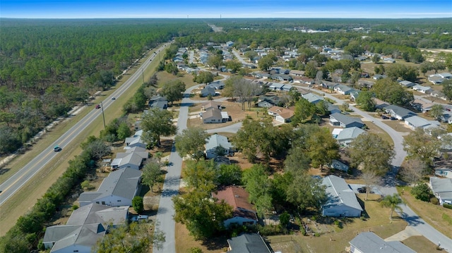 aerial view featuring a residential view and a forest view