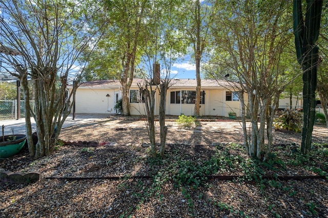 single story home with fence