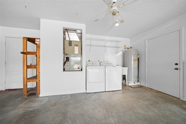 laundry area with heating unit, washing machine and clothes dryer, laundry area, water heater, and a textured ceiling