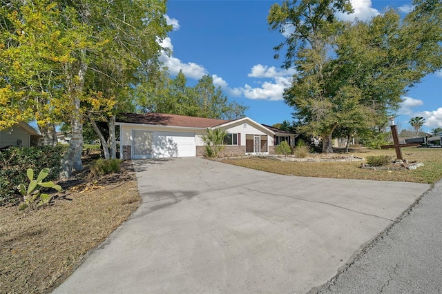 view of front of home featuring a garage and concrete driveway