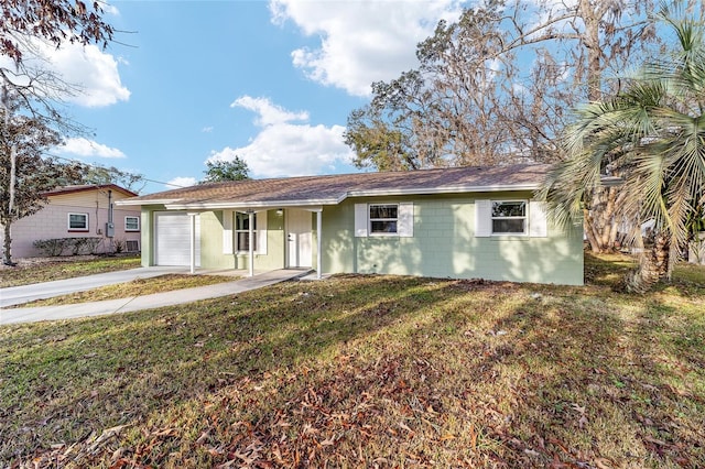 single story home featuring a garage and a front lawn