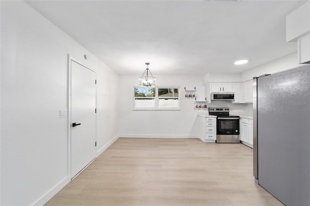 kitchen featuring white cabinetry, a chandelier, light hardwood / wood-style flooring, appliances with stainless steel finishes, and pendant lighting